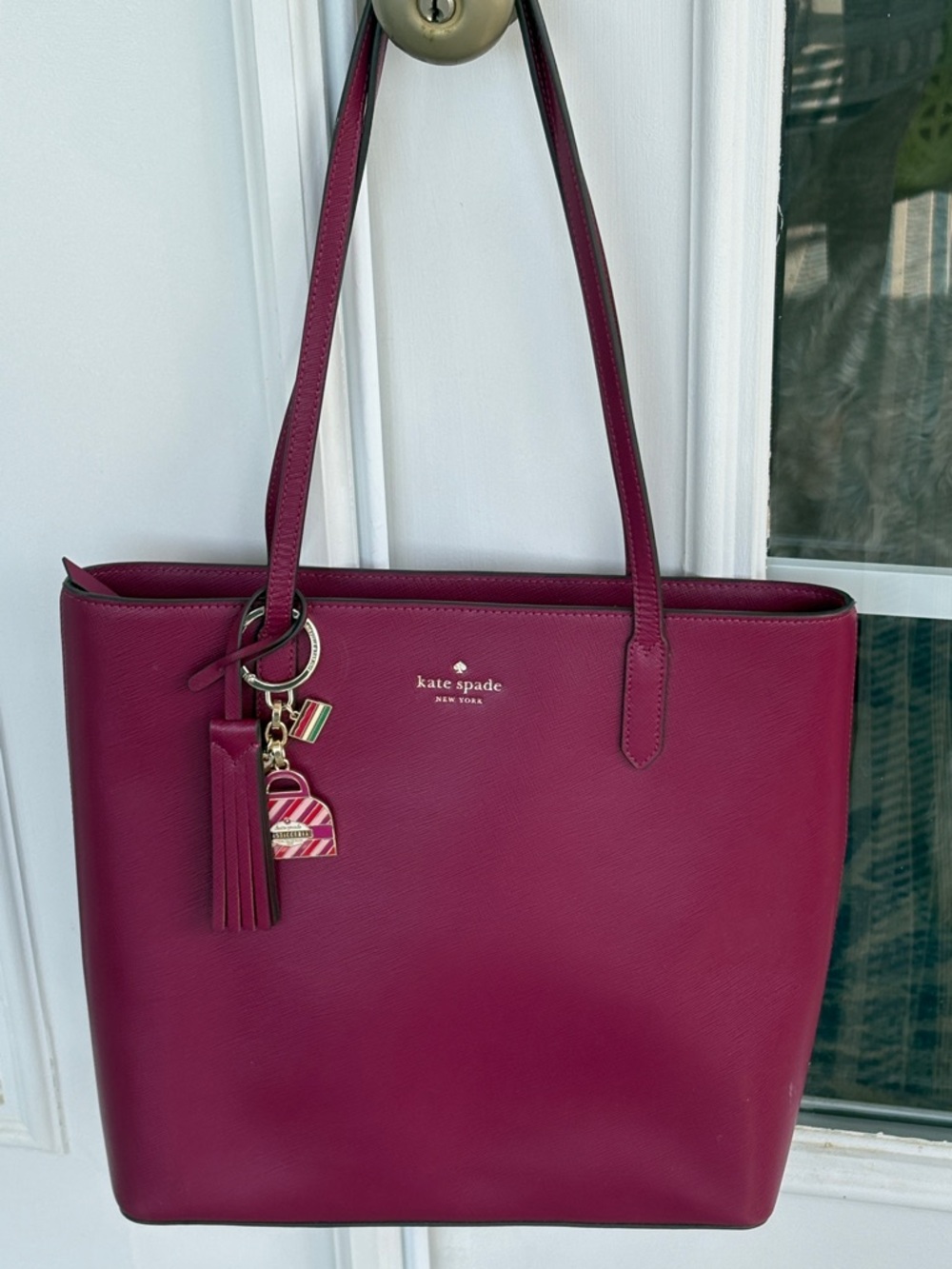 Kate Spade Burgundy Leather Tote with Tassel
13.5” W X 11.5” H